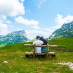 depositphotos_213241504-stock-photo-rear-view-couple-sitting-wooden